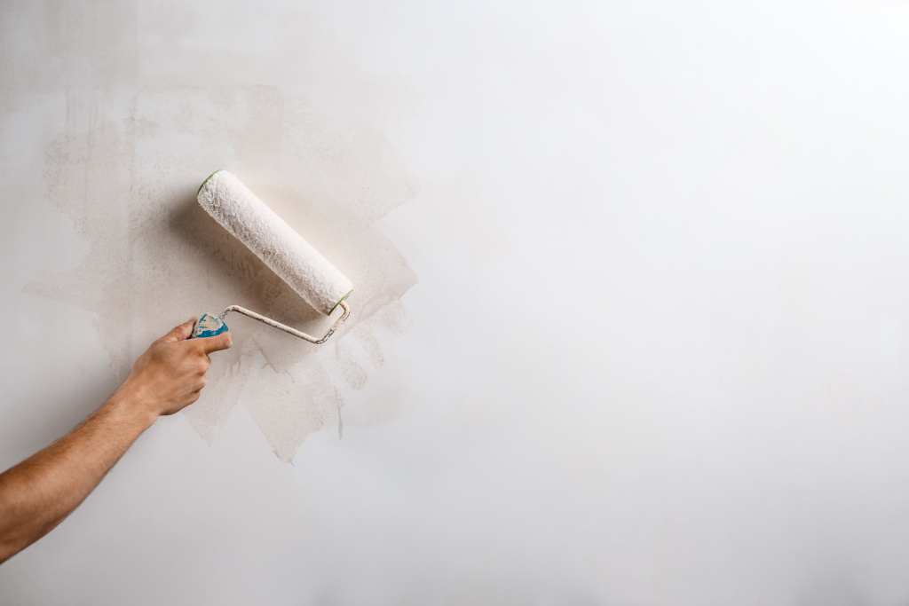 close-up-hand-painting-wall-with-roller.jpg